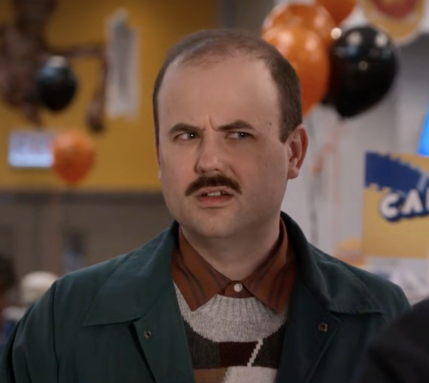 Brendan Riggs as Reggie in Blocbuster on Netflix.